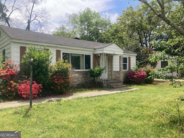 2722 Alden St, Macon, GA 31206 - view of front facade with a front lawn, stone siding, and a shingled roof