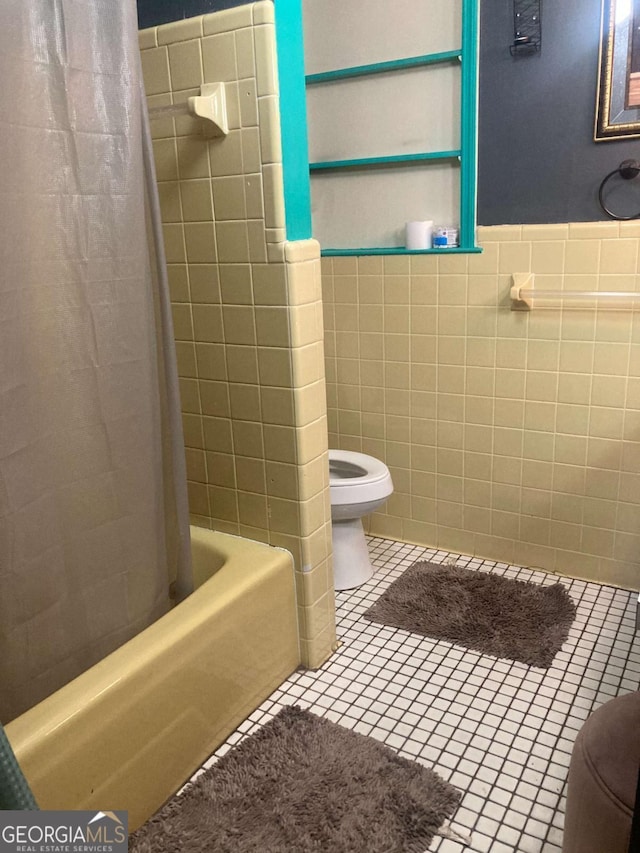 2722 Alden St, Macon, GA 31206 - bathroom with toilet, tile walls, tile patterned floors, and shower / bath combination with curtain