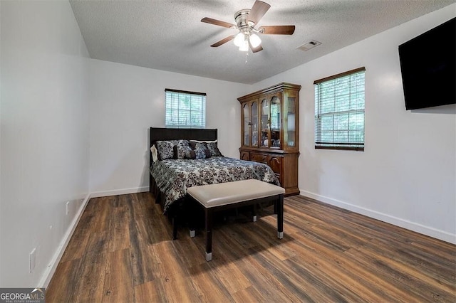 907 Magnolia Ext, Guyton, GA 31312 - bedroom with wood finished floors, a textured ceiling, and a ceiling fan