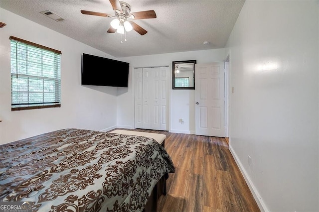 907 Magnolia Ext, Guyton, GA 31312 - bedroom with a textured ceiling, wood finished floors, a closet, and a ceiling fan