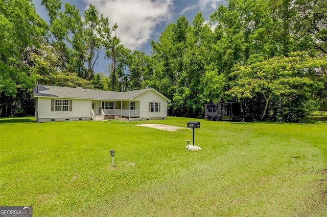 907 Magnolia Ext, Guyton, GA 31312 - view of green lawn with view of wooded area and a porch