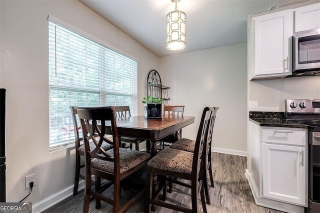 907 Magnolia Ext, Guyton, GA 31312 - dining room with baseboards, healthy amount of natural light, and dark wood-type flooring