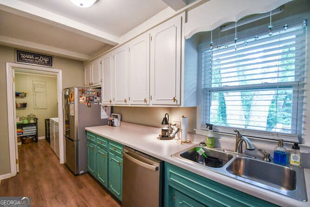 120 Chambers Ave, Cornelia, GA 30531 - kitchen with appliances with stainless steel finishes, green cabinets, white cabinets, a sink, and light countertops