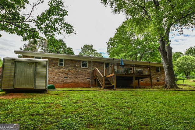 120 Chambers Ave, Cornelia, GA 30531 - rear view of house with a deck, crawl space, stairway, a yard, and brick siding