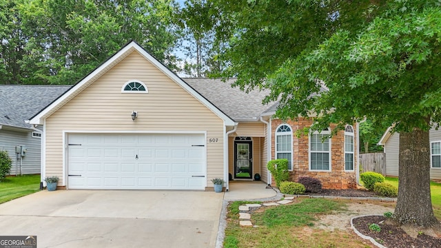 507 Hunterian Pl, Newnan, GA 30265 - view of front of property featuring a garage, concrete driveway, and roof with shingles
