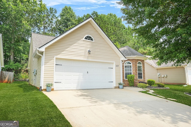 507 Hunterian Pl, Newnan, GA 30265 - view of front of home with an attached garage, driveway, and a shingled roof