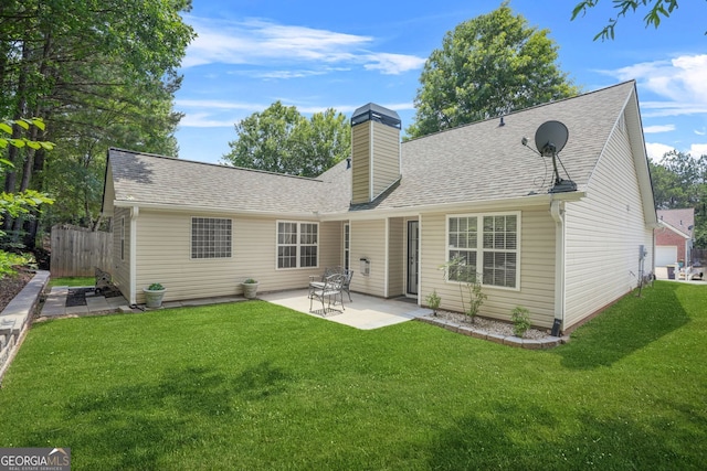 507 Hunterian Pl, Newnan, GA 30265 - back of property featuring a patio, roof with shingles, and a chimney