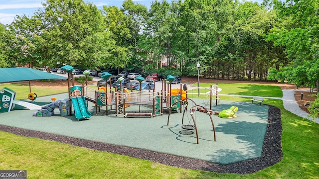 507 Hunterian Pl, Newnan, GA 30265 - communal playground featuring a lawn and view of wooded area