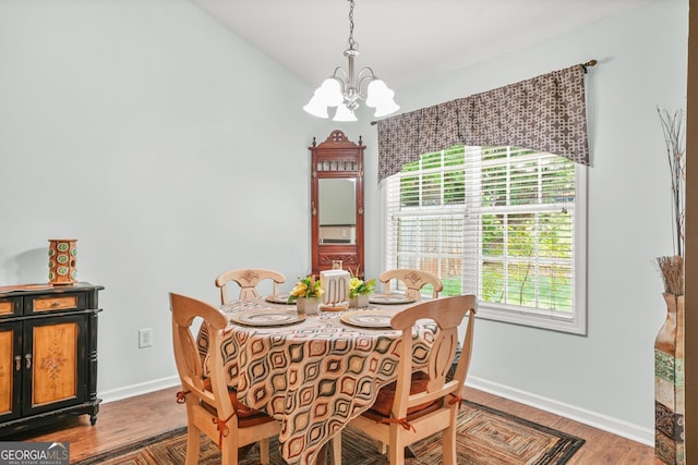 507 Hunterian Pl, Newnan, GA 30265 - dining room with a chandelier, baseboards, and wood finished floors