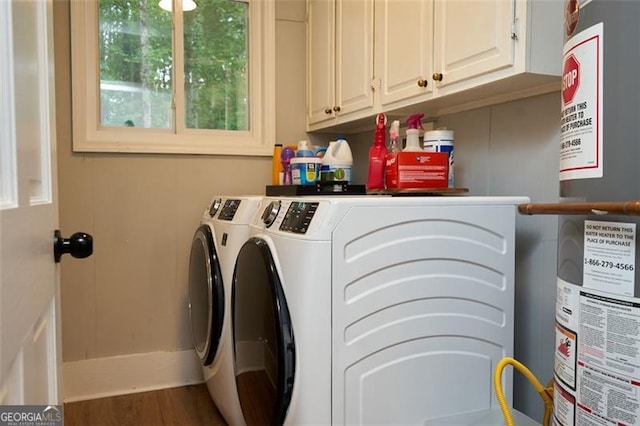 5419 Lake Dr, Douglasville, GA 30135 - laundry room with water heater, washer and clothes dryer, cabinet space, and wood finished floors