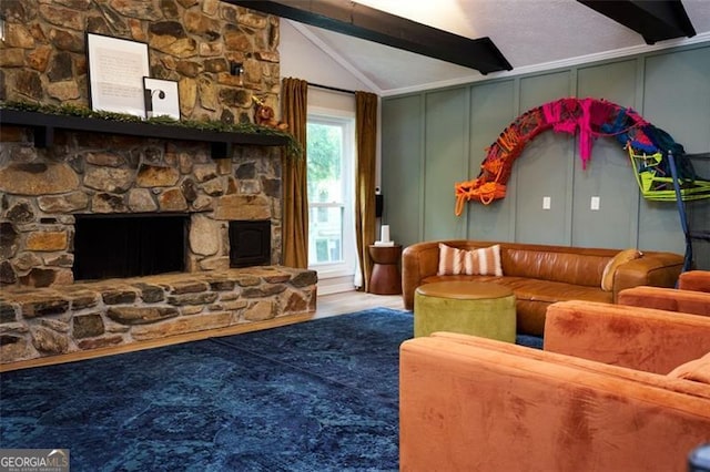 5419 Lake Dr, Douglasville, GA 30135 - living room featuring a decorative wall, a stone fireplace, and wood finished floors