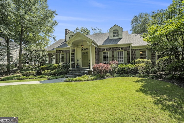 1821 N Rock Springs Rd NE, Atlanta, GA 30324 - view of front of home featuring brick siding, a front yard, and roof with shingles