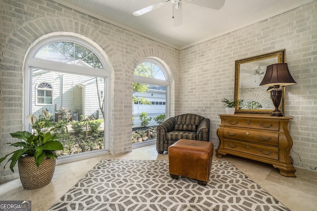 1821 N Rock Springs Rd NE, Atlanta, GA 30324 - living area with a ceiling fan, light tile patterned flooring, and brick wall