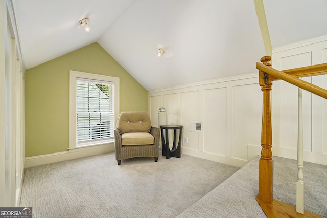 1821 N Rock Springs Rd NE, Atlanta, GA 30324 - living area with a decorative wall, carpet, and lofted ceiling