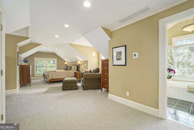 1821 N Rock Springs Rd NE, Atlanta, GA 30324 - carpeted bedroom with multiple windows, recessed lighting, lofted ceiling, and ensuite bath