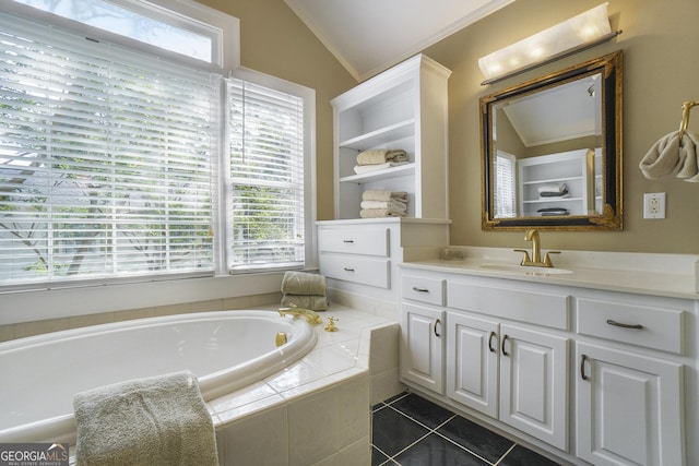 1821 N Rock Springs Rd NE, Atlanta, GA 30324 - full bath with vaulted ceiling, a bath, vanity, and tile patterned floors