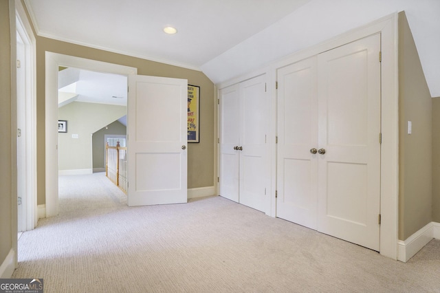 1821 N Rock Springs Rd NE, Atlanta, GA 30324 - unfurnished bedroom featuring light colored carpet, two closets, vaulted ceiling, and recessed lighting