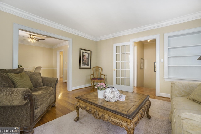 1821 N Rock Springs Rd NE, Atlanta, GA 30324 - living area with ornamental molding, wood finished floors, built in features, and ceiling fan