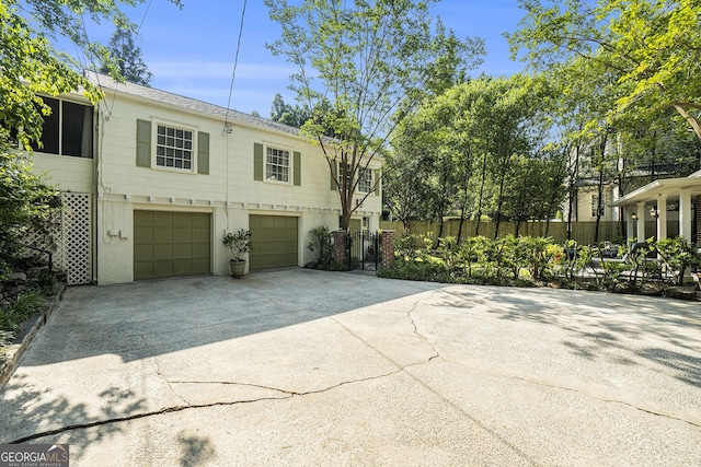 1821 N Rock Springs Rd NE, Atlanta, GA 30324 - view of side of home with driveway and a garage