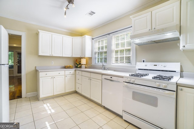 1821 N Rock Springs Rd NE, Atlanta, GA 30324 - kitchen featuring white appliances, under cabinet range hood, light countertops, light tile patterned floors, and white cabinetry