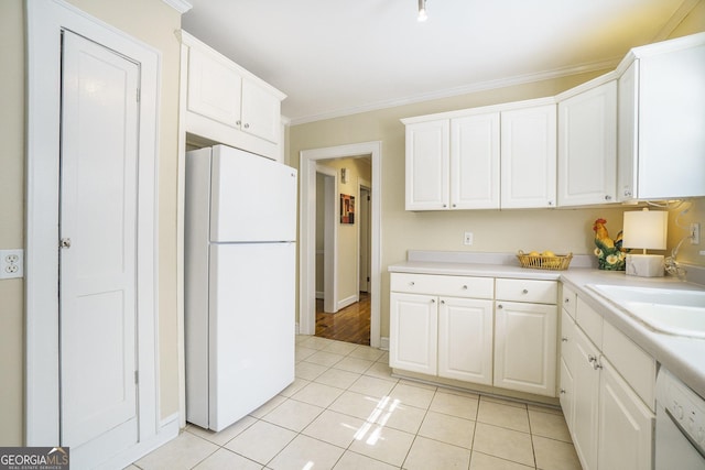 1821 N Rock Springs Rd NE, Atlanta, GA 30324 - kitchen with white appliances, light countertops, white cabinets, light tile patterned floors, and ornamental molding