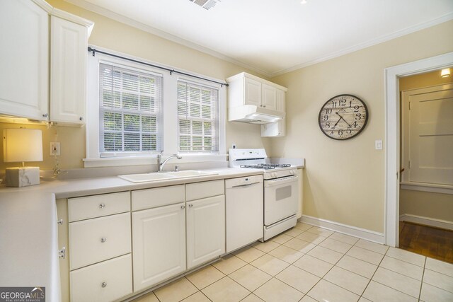 1821 N Rock Springs Rd NE, Atlanta, GA 30324 - kitchen with white appliances, under cabinet range hood, light countertops, white cabinets, and light tile patterned floors