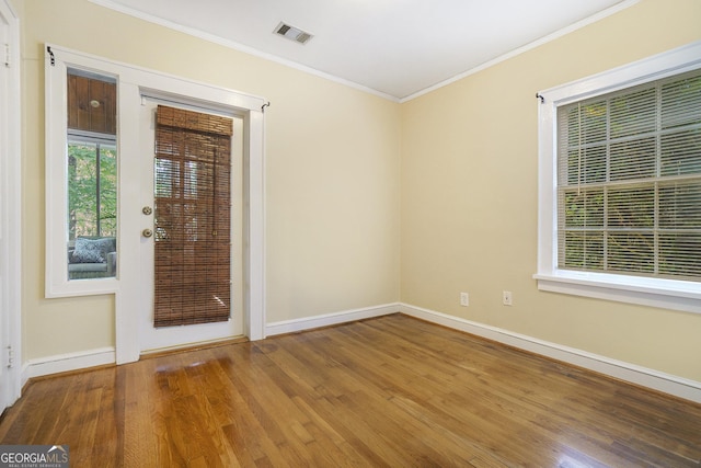 1821 N Rock Springs Rd NE, Atlanta, GA 30324 - empty room featuring crown molding and wood finished floors