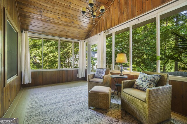 1821 N Rock Springs Rd NE, Atlanta, GA 30324 - sunroom featuring lofted ceiling, wood ceiling, hardwood / wood-style flooring, wooden walls, and a chandelier