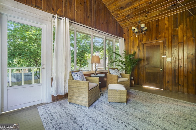 1821 N Rock Springs Rd NE, Atlanta, GA 30324 - living area with vaulted ceiling, wood walls, plenty of natural light, wood ceiling, and a chandelier