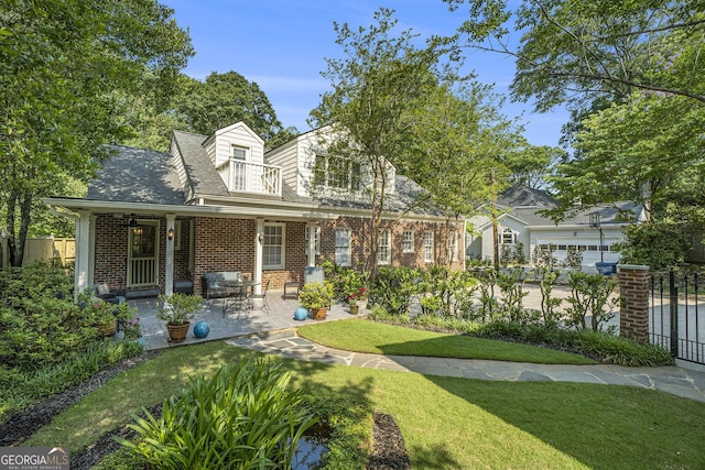 1821 N Rock Springs Rd NE, Atlanta, GA 30324 - rear view of property featuring brick siding, roof with shingles, and a patio area