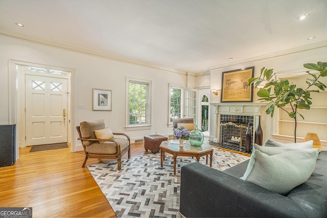 1821 N Rock Springs Rd NE, Atlanta, GA 30324 - living room with light wood-style flooring, ornamental molding, a fireplace, and recessed lighting