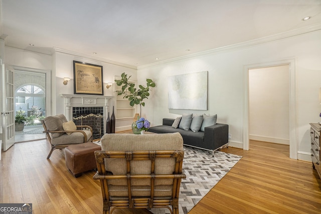 1821 N Rock Springs Rd NE, Atlanta, GA 30324 - living area featuring crown molding, light wood-type flooring, a tile fireplace, and recessed lighting