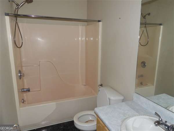 2324 Suttle Ct, Hinesville, GA 31313 - full bath with toilet, vanity, and shower / washtub combination