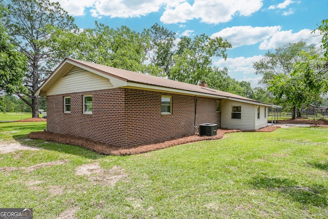 4124 W Rd, Blackshear, GA 31516 - view of side of property with a lawn, brick siding, and central air condition unit