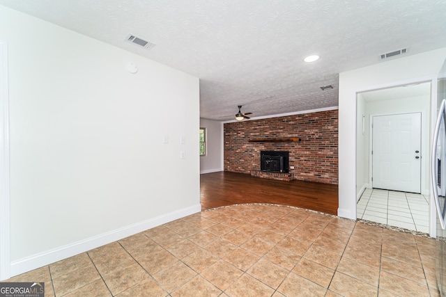 4124 W Rd, Blackshear, GA 31516 - unfurnished living room with a textured ceiling, light tile patterned floors, ceiling fan, recessed lighting, and baseboards