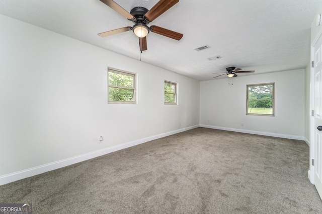 4124 W Rd, Blackshear, GA 31516 - unfurnished room featuring a ceiling fan, carpet floors, baseboards, and healthy amount of natural light