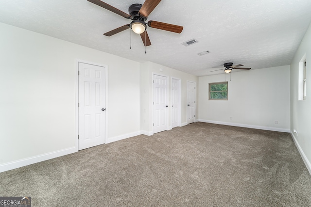 4124 W Rd, Blackshear, GA 31516 - unfurnished bedroom with carpet flooring, multiple closets, baseboards, and ceiling fan
