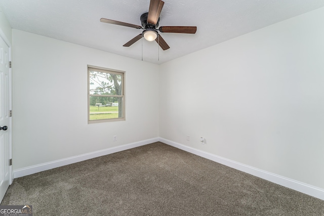 4124 W Rd, Blackshear, GA 31516 - empty room with dark carpet, baseboards, and ceiling fan