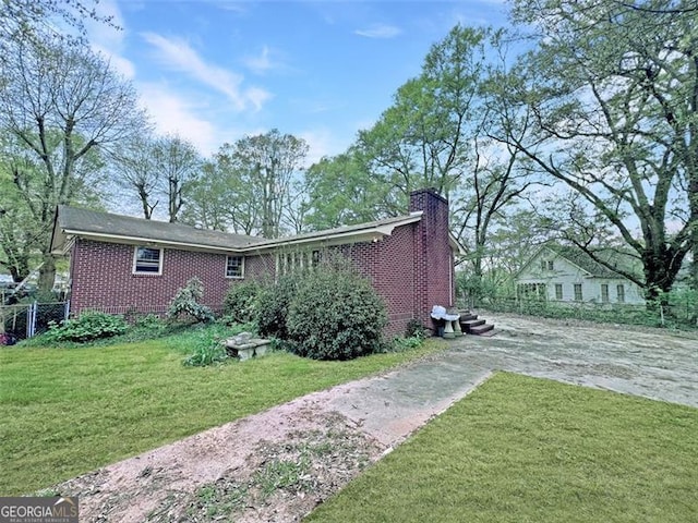 464 Church St, Royston, GA 30662 - back of property featuring brick siding, a chimney, and driveway