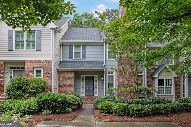 305 River Glen Dr, Roswell, GA 30075 - view of front of property with a shingled roof and brick siding