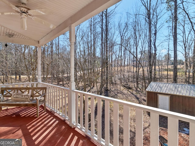 353 Wentworth Way, Griffin, GA 30224 - wooden terrace with a ceiling fan, a storage unit, and view of wooded area