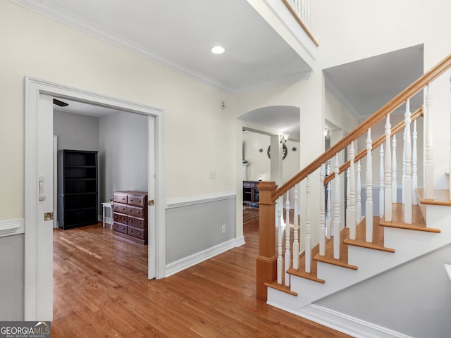 353 Wentworth Way, Griffin, GA 30224 - foyer featuring arched walkways, wood finished floors, crown molding, stairway, and recessed lighting