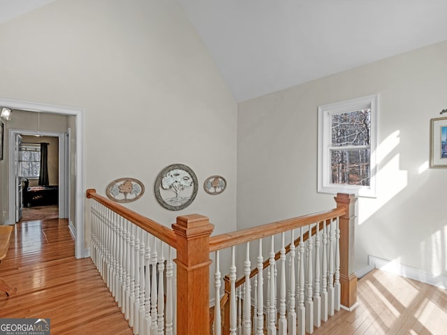 353 Wentworth Way, Griffin, GA 30224 - corridor featuring an upstairs landing, high vaulted ceiling, and light wood-style floors