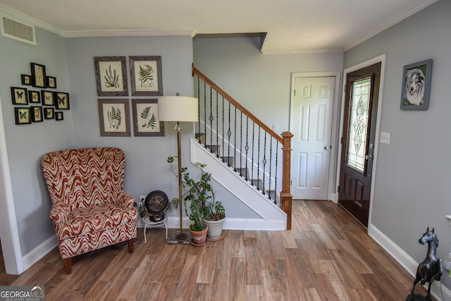 2048 Swint Rd, Griffin, GA 30224 - entryway featuring wood finished floors, stairs, ornamental molding, and baseboards