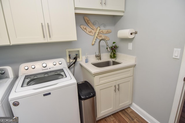 2048 Swint Rd, Griffin, GA 30224 - laundry area with washing machine and dryer, dark wood-style floors, cabinet space, and baseboards