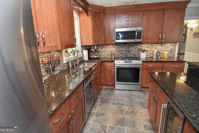 2048 Swint Rd, Griffin, GA 30224 - kitchen with stainless steel appliances, wine cooler, a sink, and brown cabinets