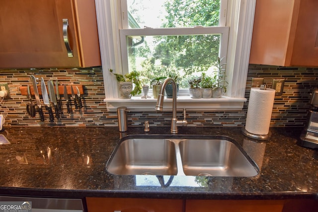 2048 Swint Rd, Griffin, GA 30224 - kitchen view of a sink, decorative backsplash, dark stone countertops, and dishwasher