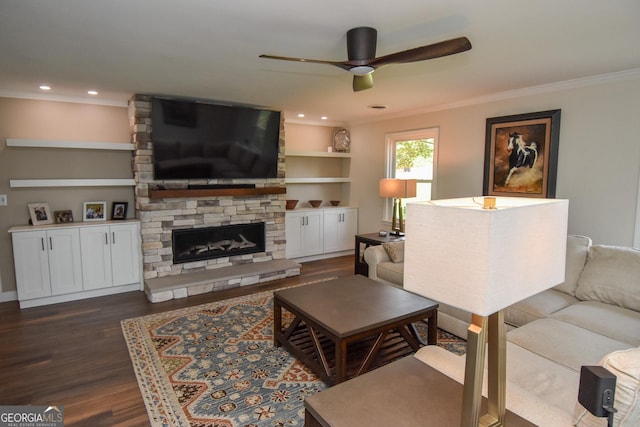 2048 Swint Rd, Griffin, GA 30224 - living area with dark wood-style flooring, ceiling fan, crown molding, a fireplace, and recessed lighting