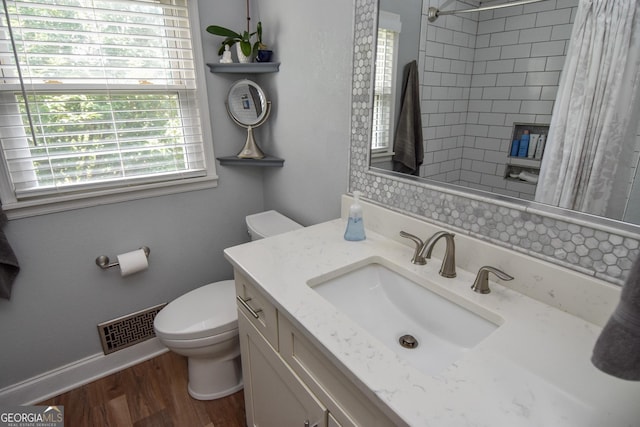 2048 Swint Rd, Griffin, GA 30224 - bathroom featuring toilet, a shower with curtain, wood finished floors, vanity, and baseboards