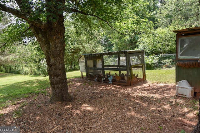 2048 Swint Rd, Griffin, GA 30224 - view of grassy yard with exterior structure and an outdoor structure